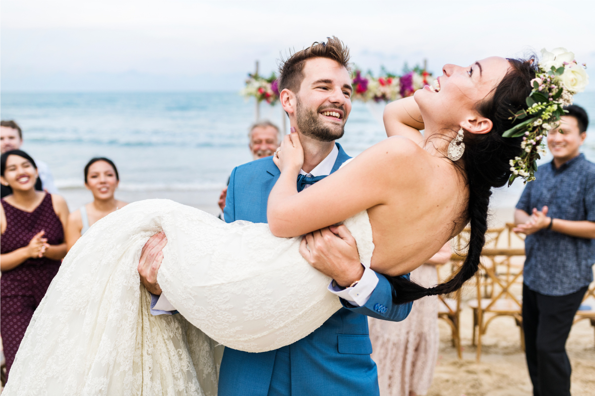 Cheerful Newlyweds at a Beach